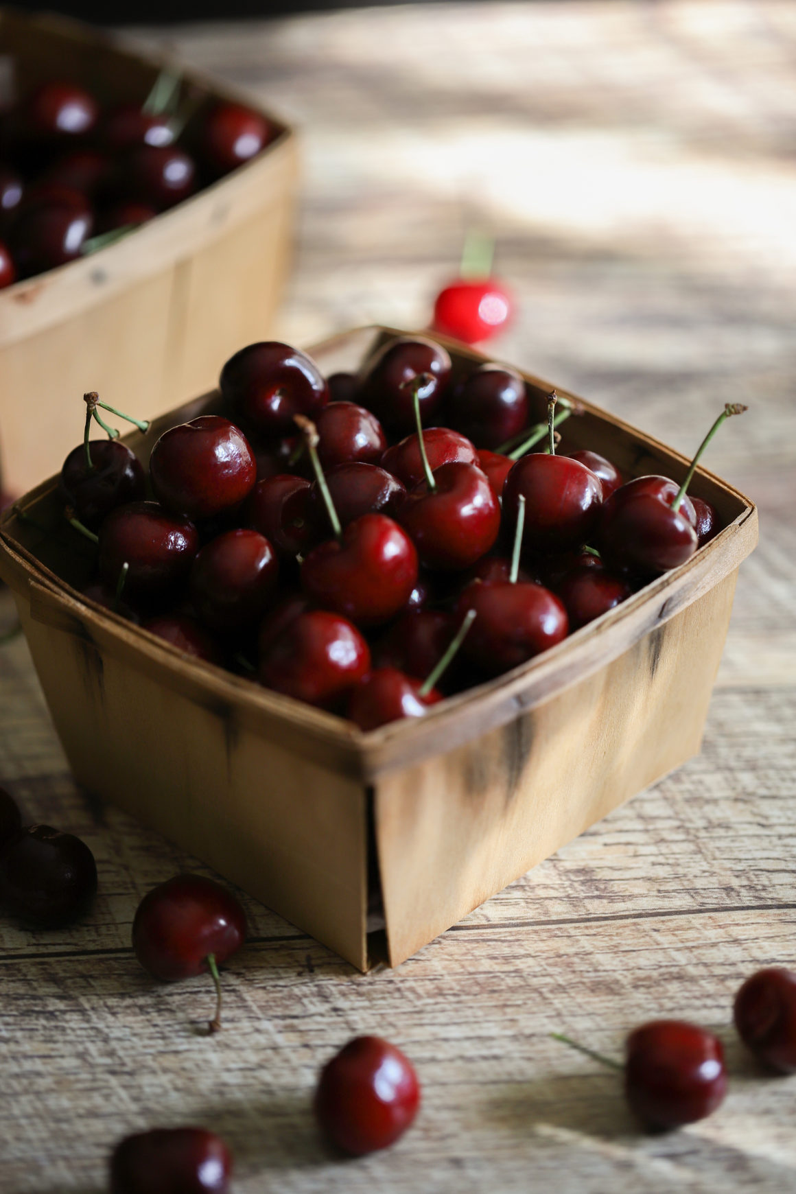 bing cherries in a wooden basket