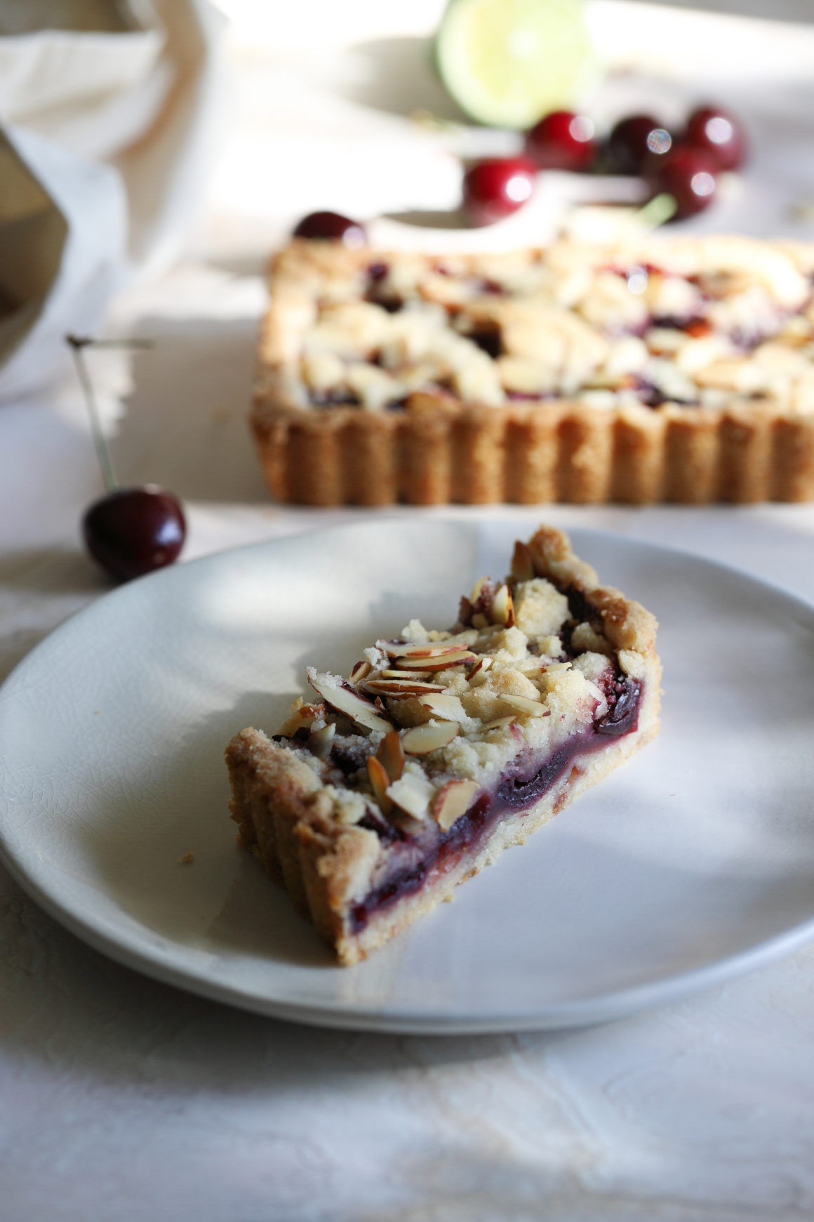 cherry tart with almond and lime infused sweet pastry crust
