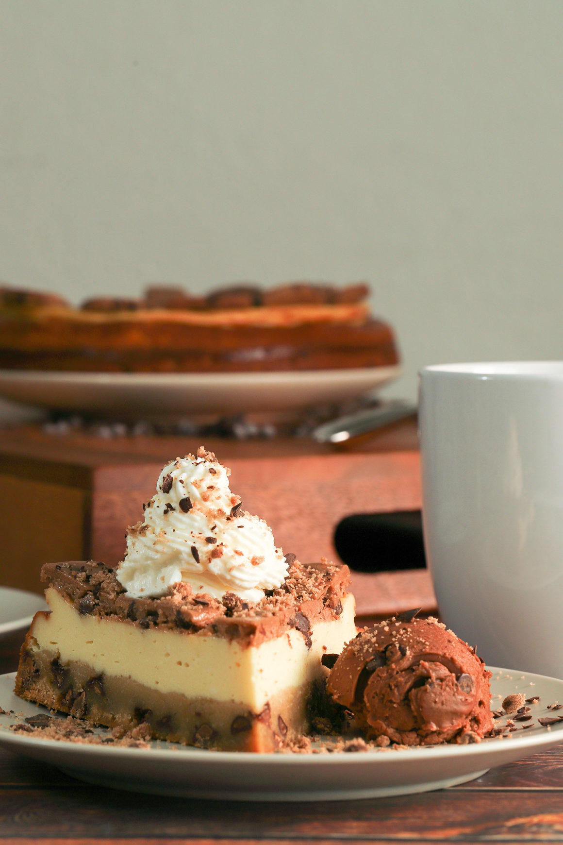 cookie dough cheesecake whole with slice tall