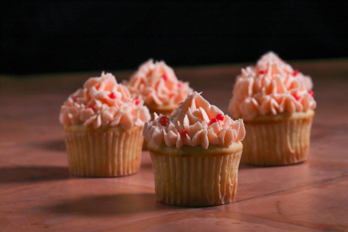 Orange Cupcakes with Frosting and Sprinkles