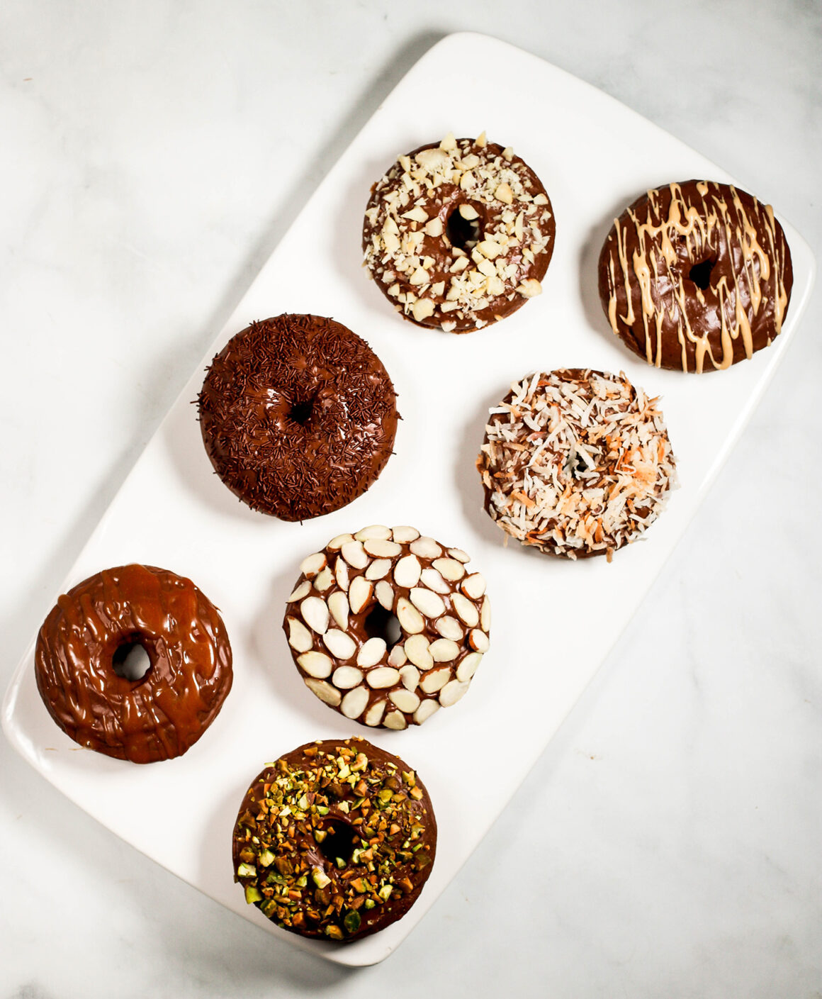 chocolate doughnuts on serving platter