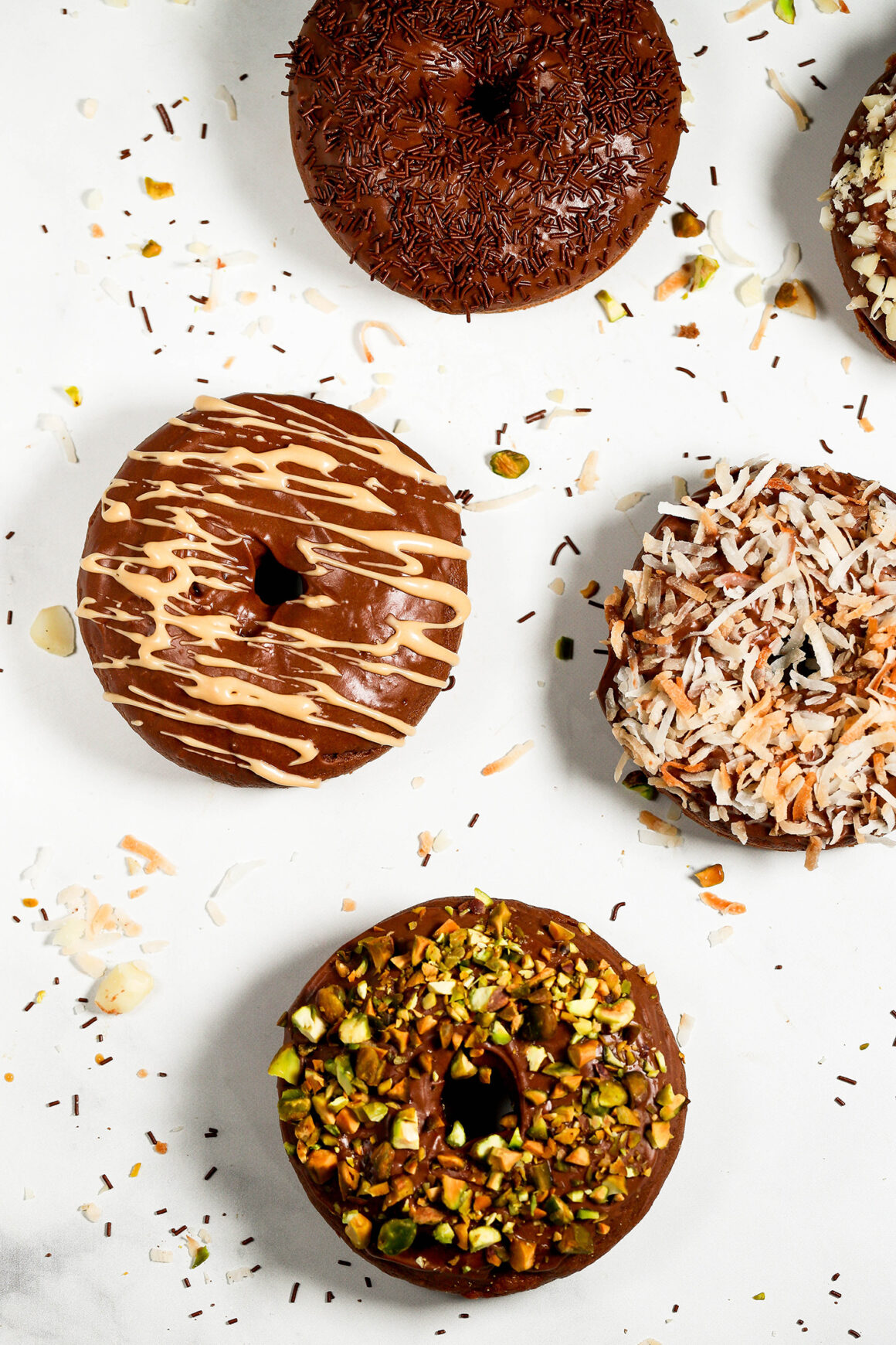 chocolate doughnuts on marble countertop