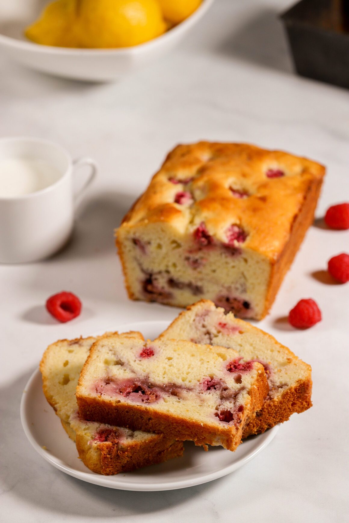 Loaf of Raspberry Bread with Slices on Plate