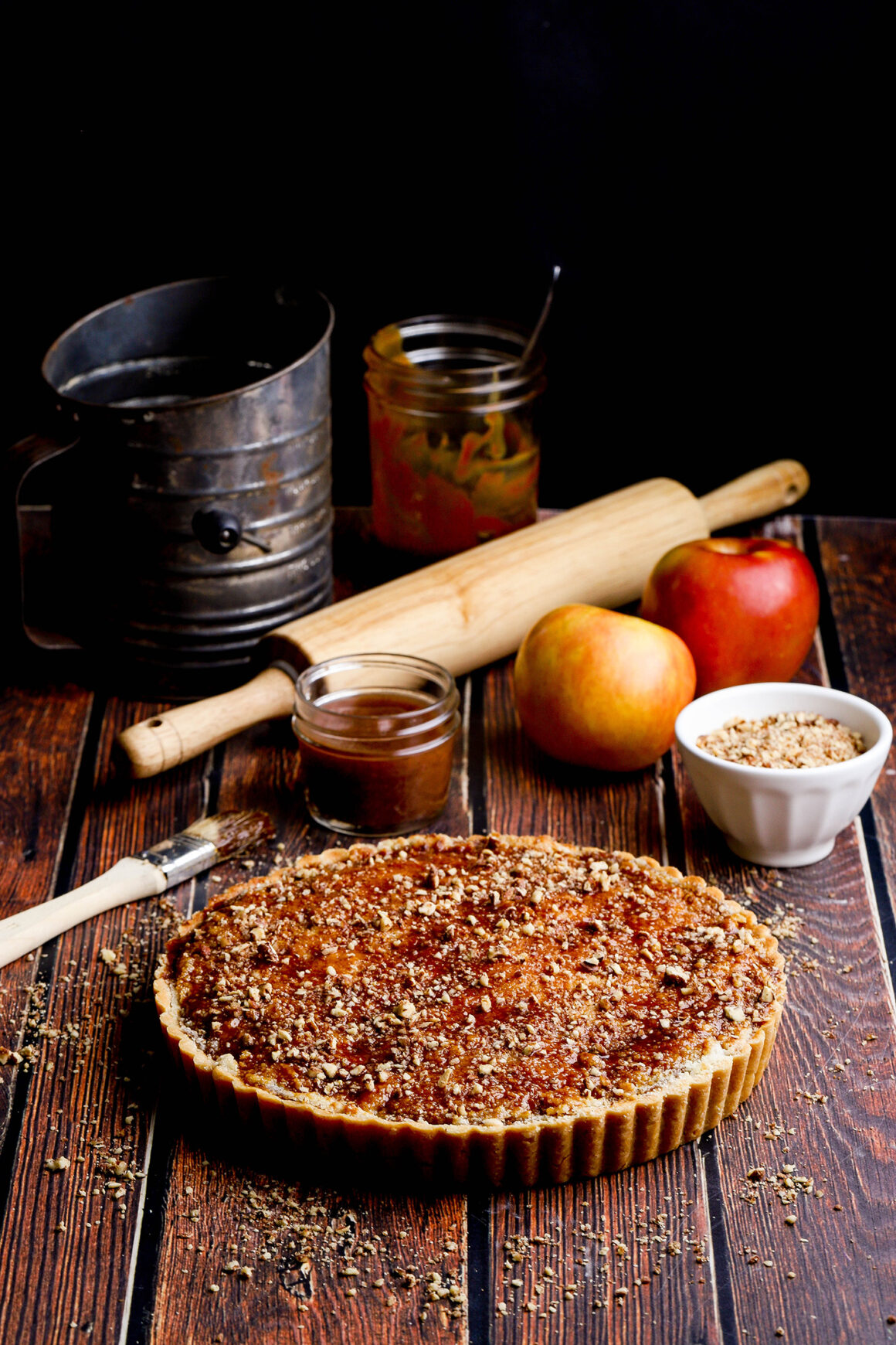 baked apple pecan tart with caramel and candied pecans