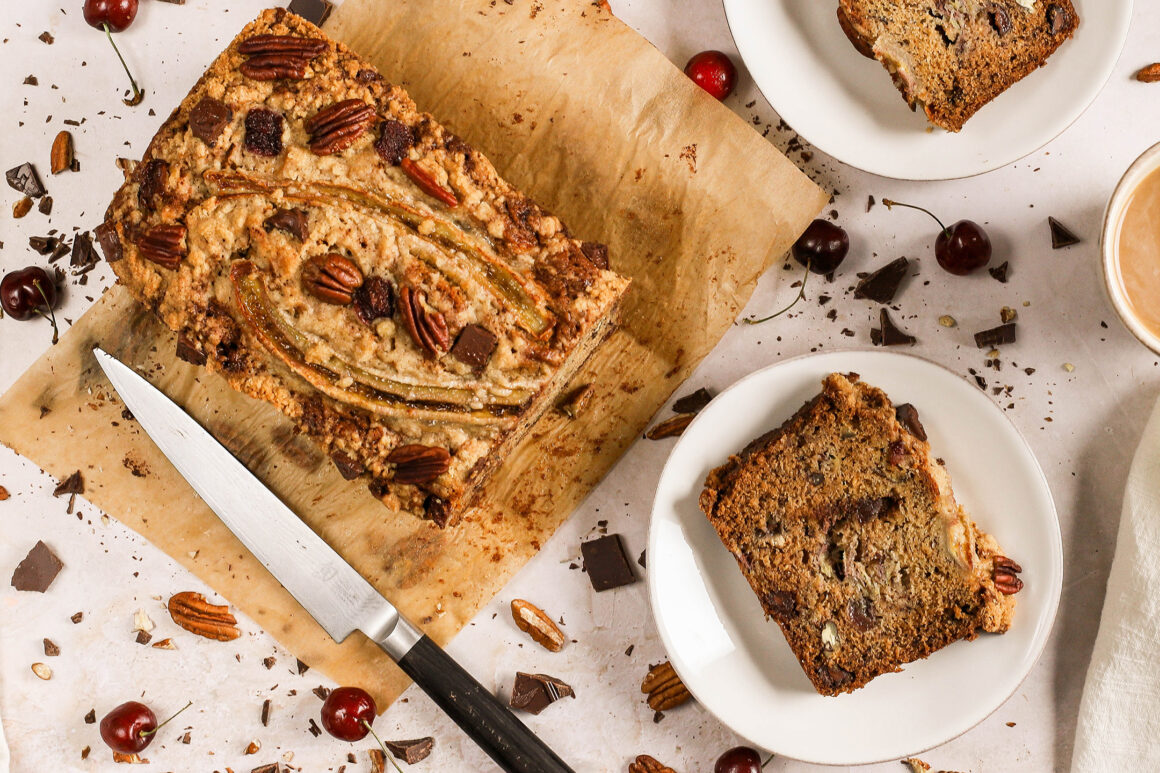banana bread loaf with chocolate, cherries and pecans